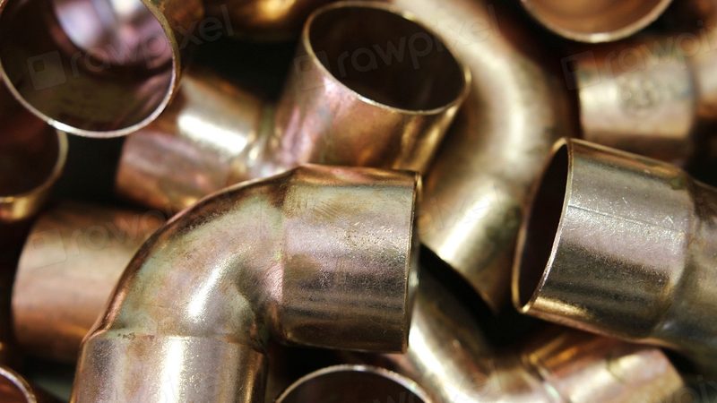 Copper pipe fittings and elbows used to fix a water pipe inside a wall